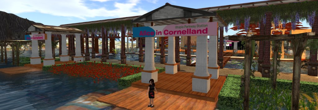 Vanessa Blaylock, the younger, standing in front of the arrival depot at the Utopia Parkway station at Alice in Cornellad