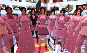 A large group of avatars stand in a circle. They all wear variously modified versions of the iconic Second Life "Girl Next Door" noob avatar dress.