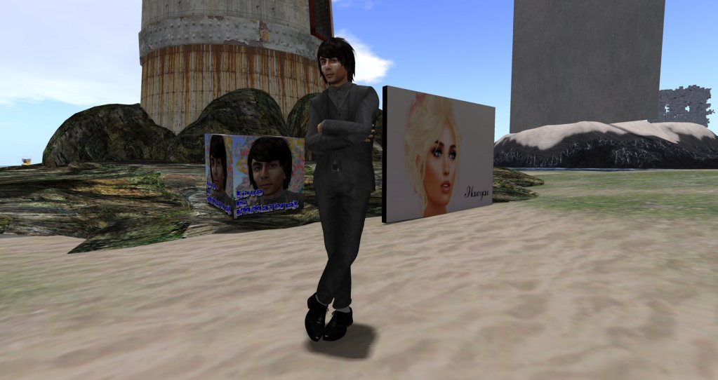 Yves Klein standing next to photos of himself & Ilse Sporag