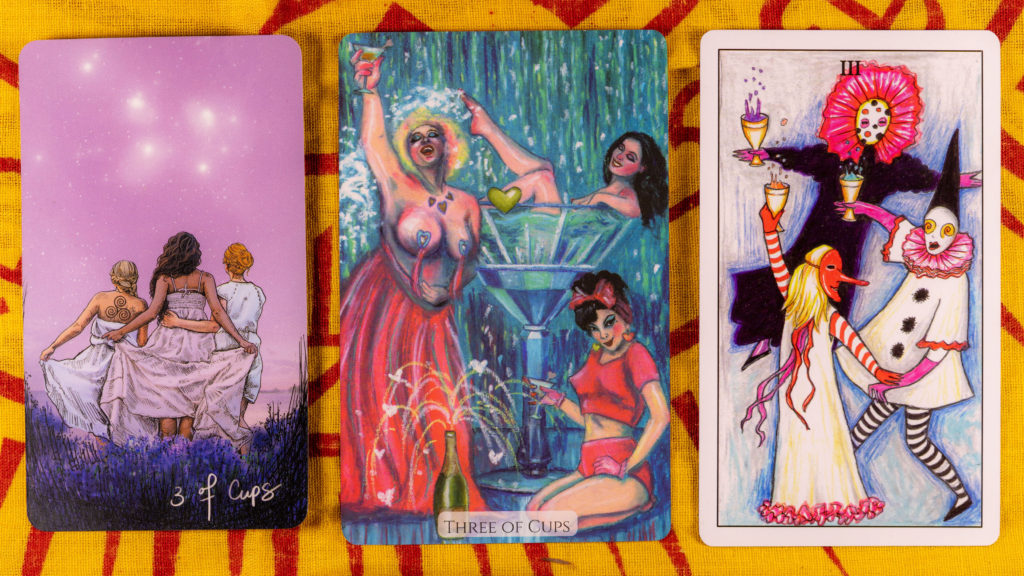 The 3 of Cups from different tarot decks. The cards depict 3 women together, mostly dancing. 