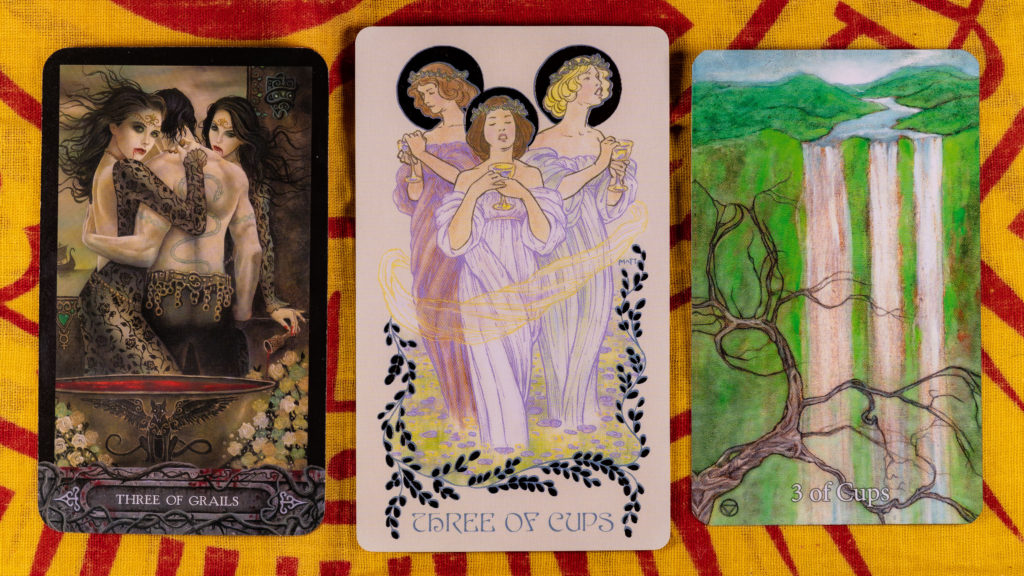 The 3 of Cups from 3 different tarot decks. The first two cards depict 3 people together and the 3rd card shows 3 streams leading to waterfalls.