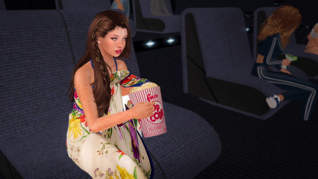 Aero Bigboots eating popcorn in the SLCS Video Room and listening to a discussion about 2022 events.