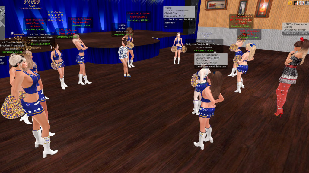 Cheerleaders gathered after practice to listen to announcements.