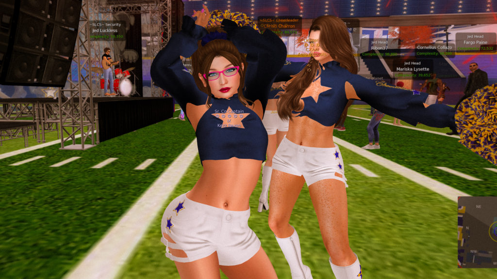 Cheerleaders Kezz Rexen and Aero Bigboots dancing at the side of the stage at Phish Bowl XIII at Skytower Stadium in Second Life.