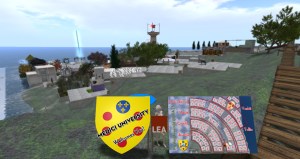 A wide view of the Medici University campus at LEA-23 in Second Life. In the foreground are a large, yellow, Medici family crest and a street map of the 96 artist's studios on campus. Beyond these signs are the many studios and a lighthouse in the distance.